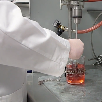 chemist stirring beaker