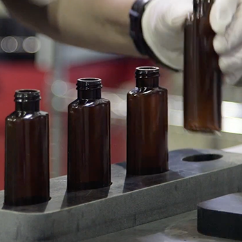 small bottles being filled